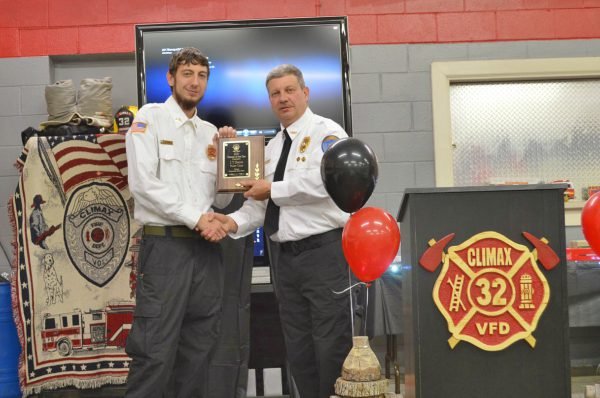 Fire Chief Tim Smith presenting award to his son JT Smith award
